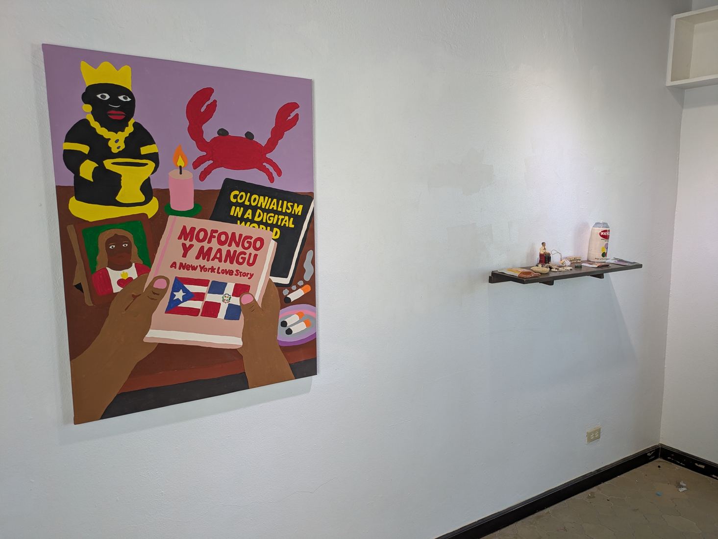 Large painting beside a shelf of small objects